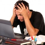 Young man having trouble studying, on white background