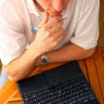 Young Casual Businessman with Laptop. Soft light from above. Camera: 12,8mp full frame Canon 5D, using mostly a Canon 70-200mm 2.8L USM IS.